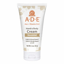 White tube of Carlson Labs A·D·E Hand & Body Cream with orange and tan leaf design, labeled unscented, 2 oz.