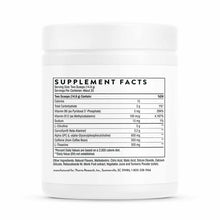 White container of Thorne Research Advanced Pre-Workout powder with supplement facts label visible.