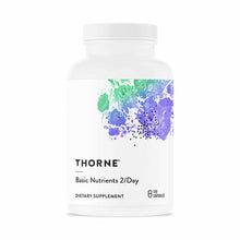 White plastic bottle of Thorne Basic Nutrients 2/Day dietary supplement containing 120 capsules with colorful watercolor desi