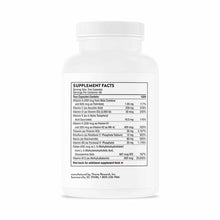 White plastic bottle of Basic Nutrients 2/Day multivitamin capsules by Thorne Research with supplement facts label.