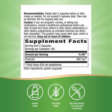 Supplement label showing 560 mg activated charcoal capsules with usage instructions, nutrition facts, and certification icons