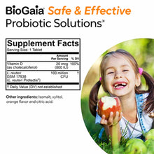 BioGaia probiotic supplement facts label with child eating apple outdoors on right side.