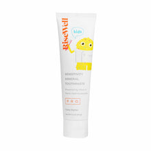 White tube of RiseWell Kids mineral toothpaste with yellow cartoon character illustration and orange branding on front.