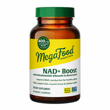 Amber glass bottle with green cap containing MegaFood NAD+ Boost dietary supplement capsules, 60 capsules, 30 servings.
