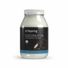 Glass jar of Solspring organic coconut oil with white cap and black label featuring coconut illustrations.