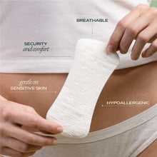 Two hands hold a white panty liner above light underwear, with text labels reading breathable, security and comfort, gentle on sensitive skin, and hypoallergenic.