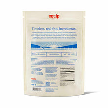 Back of a cream Equip Foods Prime Protein pouch showing a supplement facts panel, barcode, and pastoral sunrise illustration.