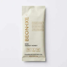 BEONIXE raw energy honey packet with electrolytes, 0.9 oz, cream-colored wrapper with gold text and nutrient labels.