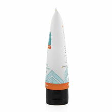 White tube with orange and teal design elements and black base cap for Redmond Clay Facial Mud with Silver.
