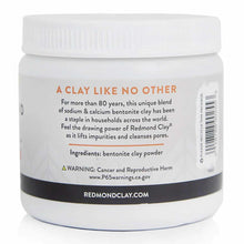 White plastic jar with white screw cap containing bentonite clay powder, labeled with orange and black text.