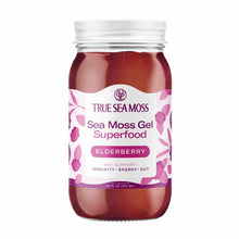 Clear glass jar with white screw-top lid containing deep red gel, labeled "True Sea Moss" elderberry superfood, 16 fl oz.