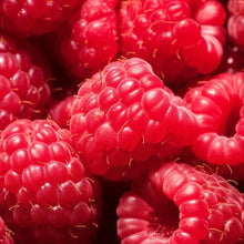 Close-up of bright red raspberries with visible drupelets and small stems.