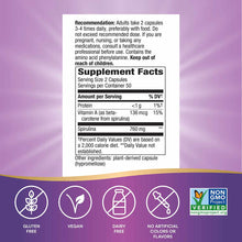 White supplement label with black text displaying dosage recommendations and nutrition facts for spirulina capsules on purple