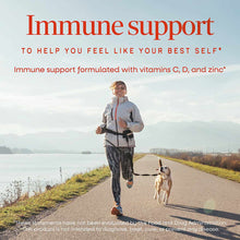 Woman jogging along a waterside path with a dog, with text describing immune support supplement with vitamins C, D, and zinc.