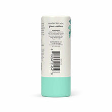 Cylindrical stick balm with cream and turquoise label showing ingredients and barcode for Ola Botanicals foot balm.