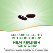 Two dark brown oval supplement capsules on a green and white background.