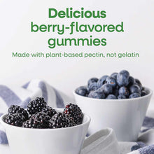 Berry-flavored gummies in white bowls with blackberries and blueberries displayed beside them.