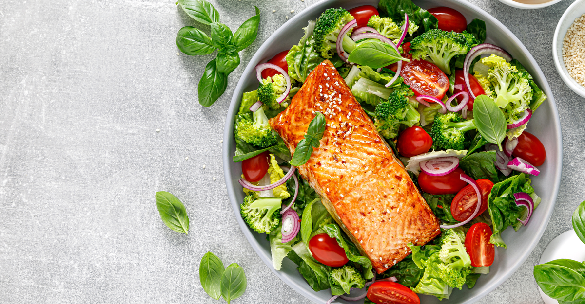 A salmon salad in a white bowl