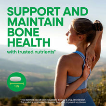 Tablet supplement packaging showing woman from behind in blue sports bra touching her shoulder, with green text and landscape