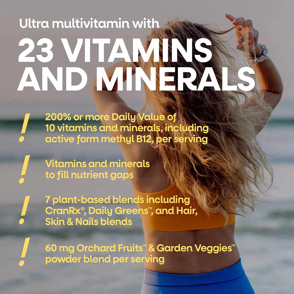 Bottle of Nature's Way Alive Once Daily Women's Ultra Potency multivitamin supplement displayed against beach background.