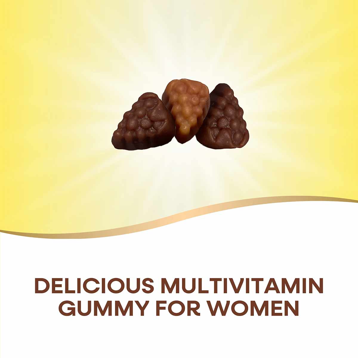 Three brown gummy vitamins on a yellow and white background.