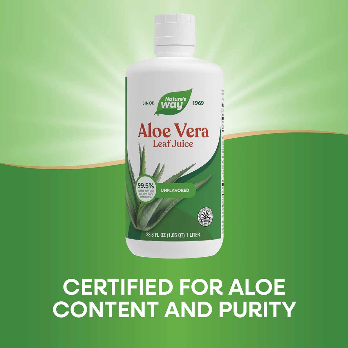 White plastic bottle of Nature's Way Aloe Vera Leaf Juice with green leaf logo and white cap against green background.