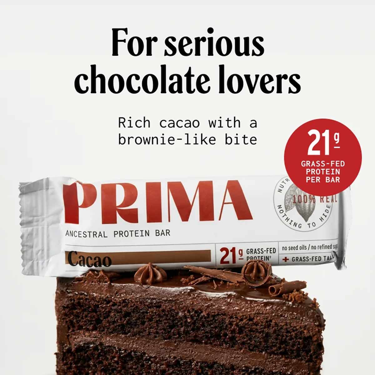 PRIMA Ancestral Protein Bar in cacao flavor with chocolate brownie texture and 21g grass-fed protein per bar.