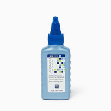 Light blue bottle with blue flip-top cap containing Andalou Naturals Argan Stem Cell Scalp Intensive for thinning hair.