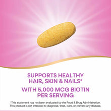 Yellow oval biotin supplement tablet on pink background with radiating light effect.