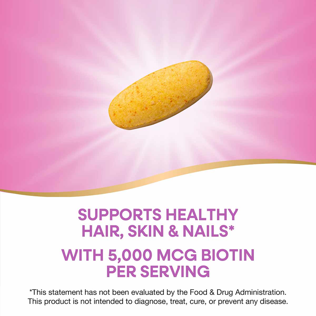 Yellow oval biotin supplement tablet on pink background with radial light effect.