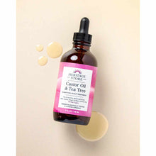 Dark amber glass dropper bottle with pink label containing Castor Oil & Tea Tree treatment, surrounded by oil droplets on bei