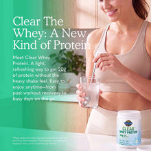 Woman in athletic top holding glass of clear liquid next to white container of Garden of Life Clear Whey Protein powder.