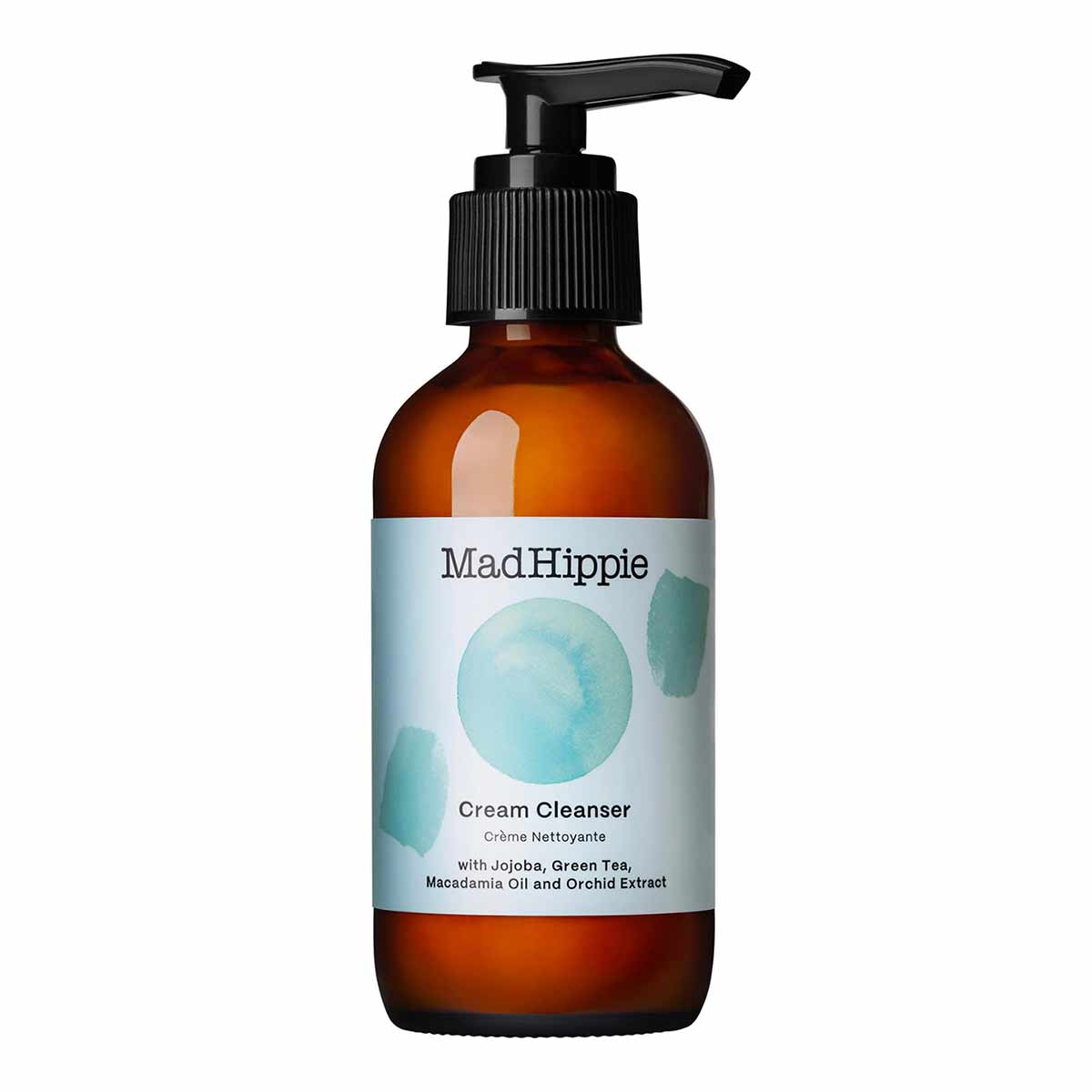 Dark amber glass bottle with black pump dispenser and white label featuring "Mad Hippie Cream Cleanser" text and blue waterco