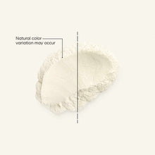 Cream-colored powder with natural color variation shown on light background with reference line.