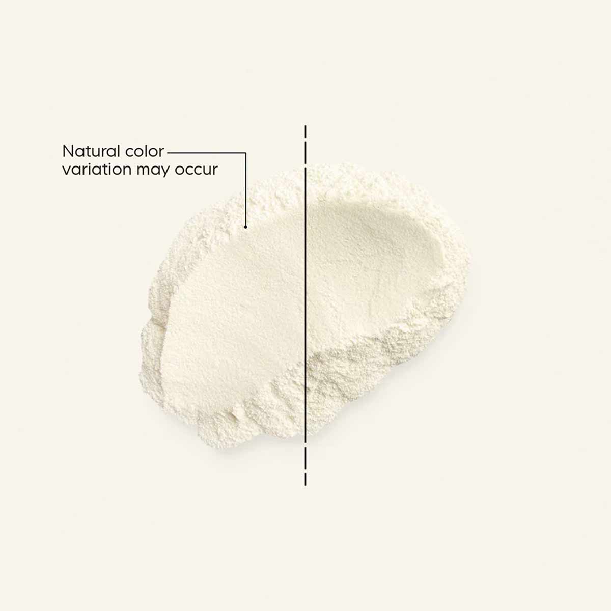 Cream-colored powder with natural color variation shown on light background with reference line.