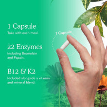 A hand holds one white capsule against a green background with text listing one capsule, 22 enzymes, and B12 and K2.