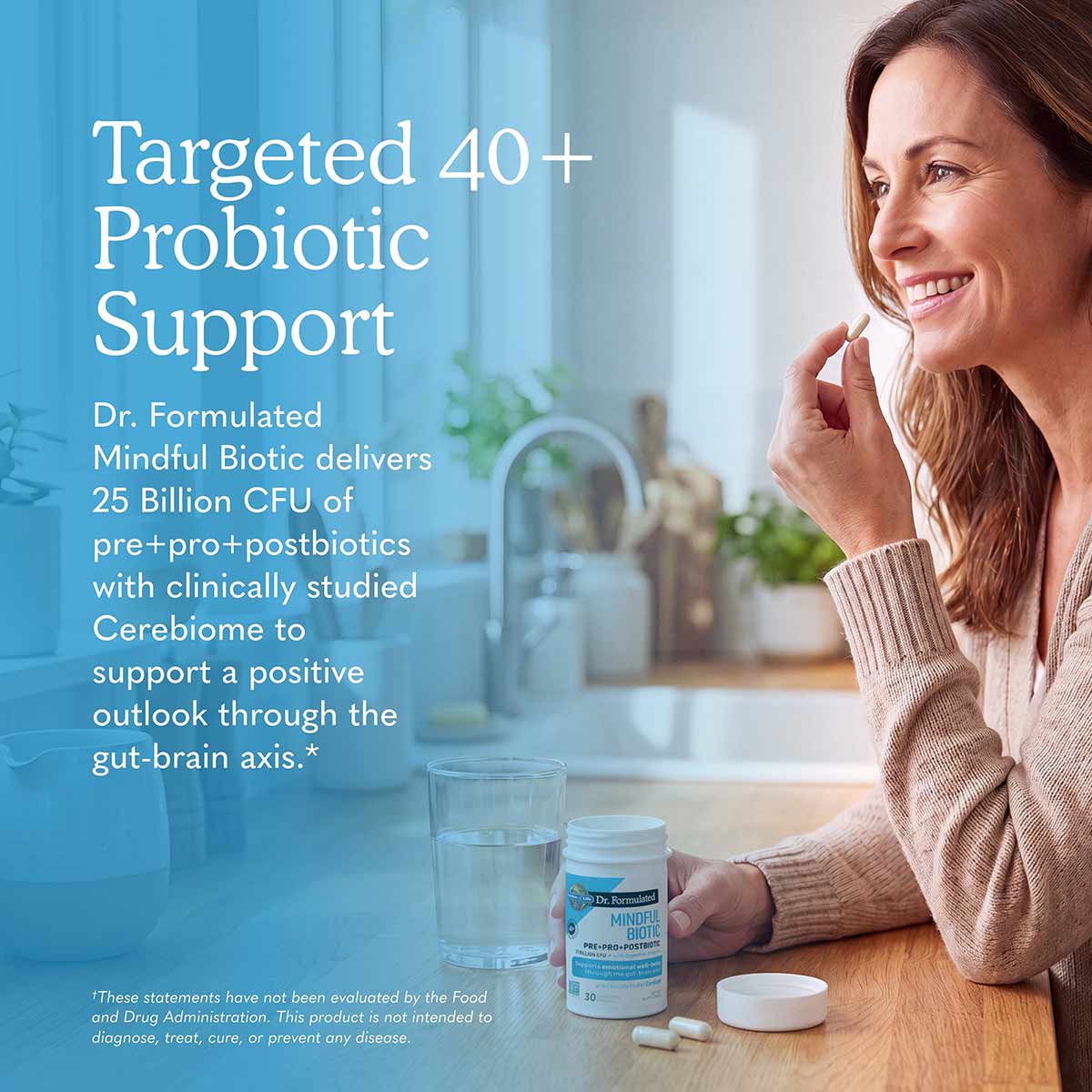 Dr. Formulated Mindful Biotic probiotic supplement bottle next to a glass of water on a wooden table.