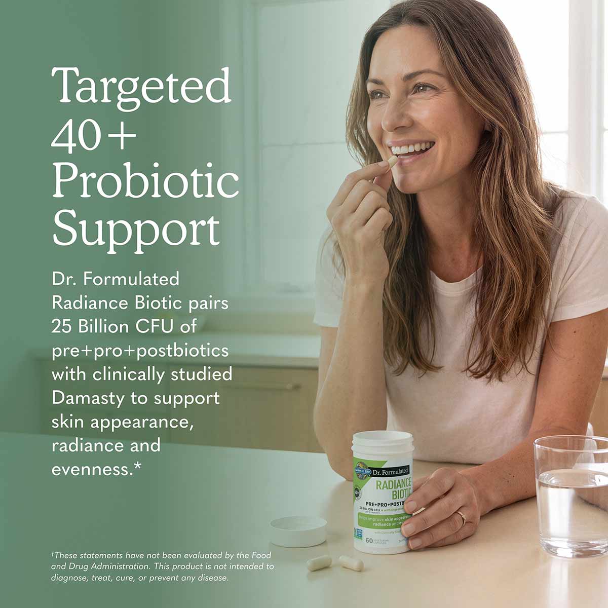 White bottle labeled "Dr. Formulated Radiance Biotic" with green accents, displayed next to a glass of water on a table.