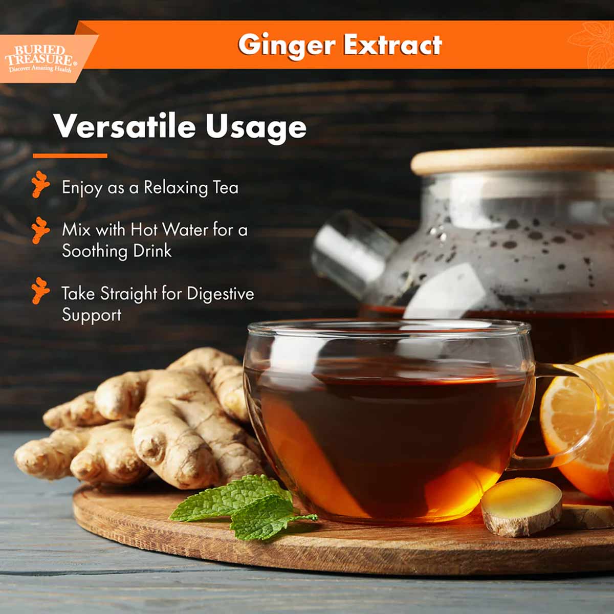 Ginger root, brewed ginger tea in glass cup, fresh mint leaf, and lemon slices on wooden board.