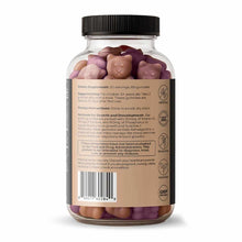Clear glass bottle with black screw cap containing pink, tan, and purple gummies labeled as dietary supplement with ingredien