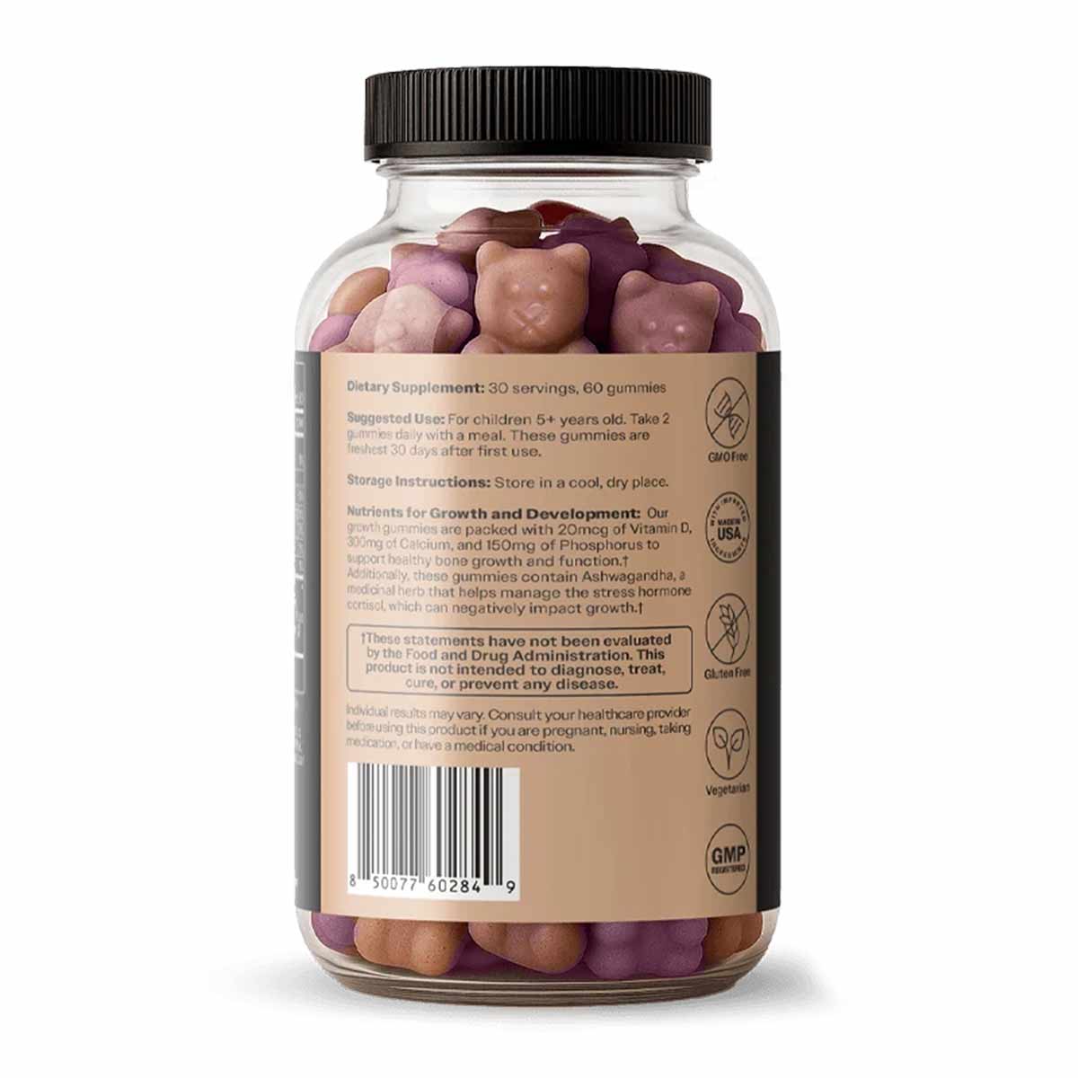 Clear glass bottle with black screw cap containing pink, tan, and purple gummies labeled as dietary supplement with ingredien