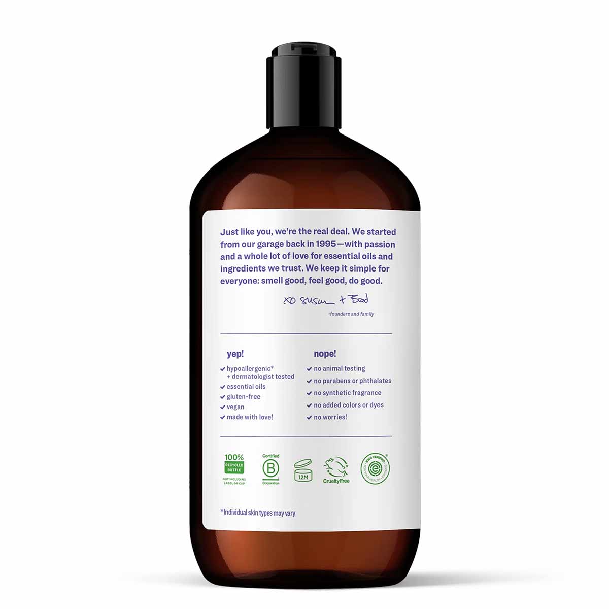 Brown glass bottle with black pump dispenser containing hand soap with product information and certification logos on label.