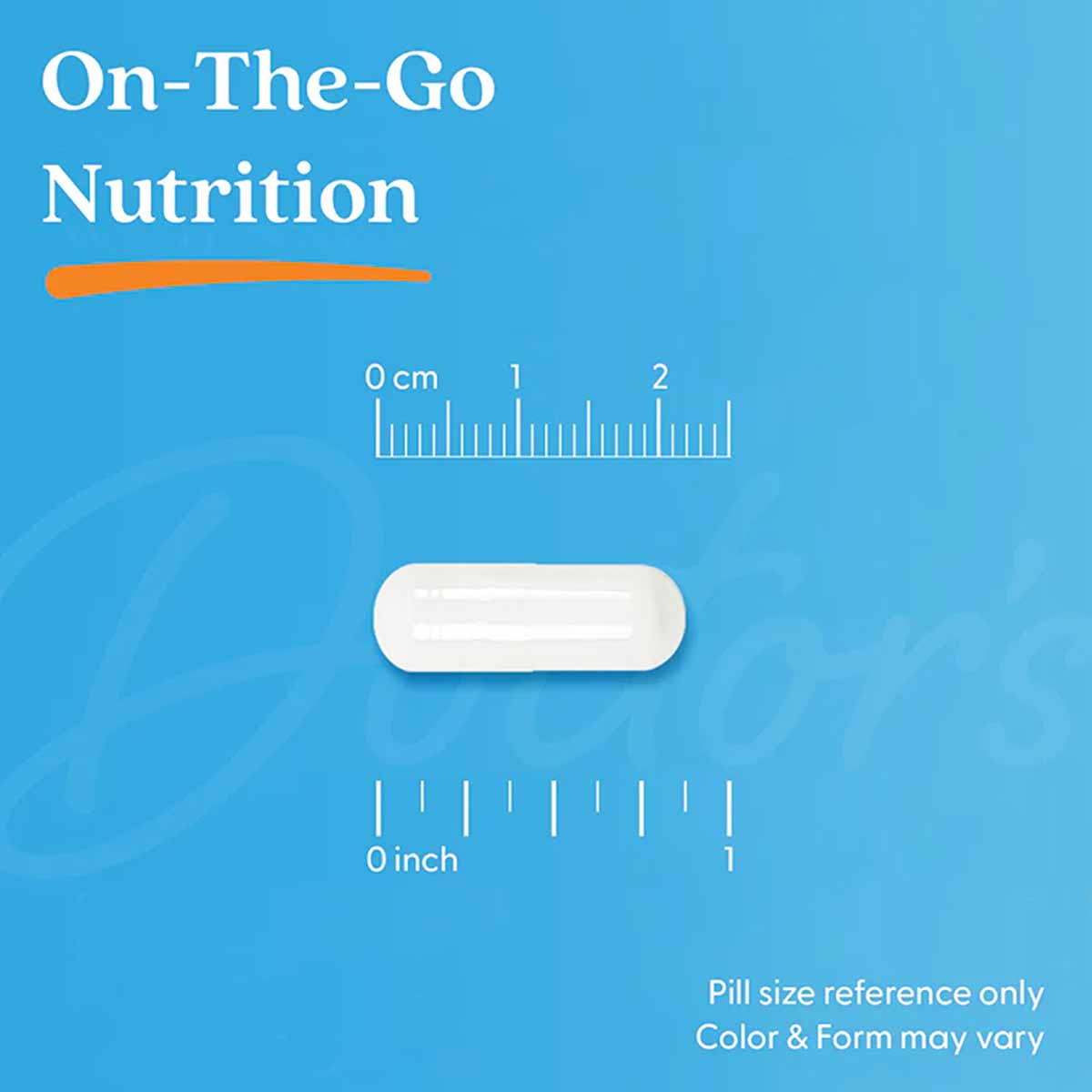White oval magnesium supplement capsule shown next to centimeter and inch rulers on blue background.