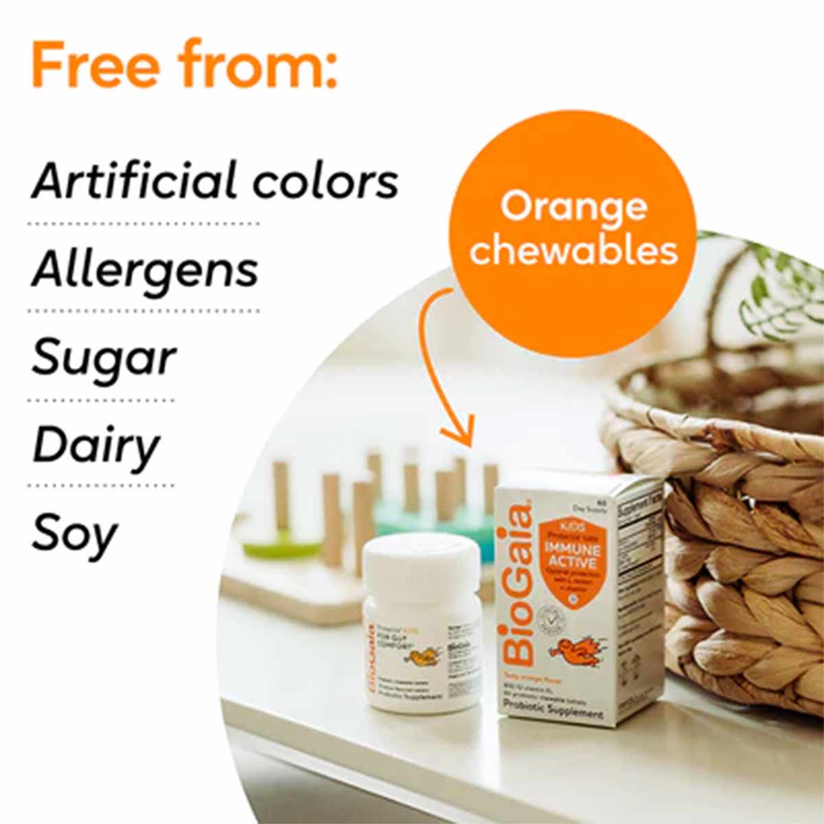 BioGaia Immune Active Kids probiotic bottle and box displayed with almonds and toothbrushes, listing free from artificial col
