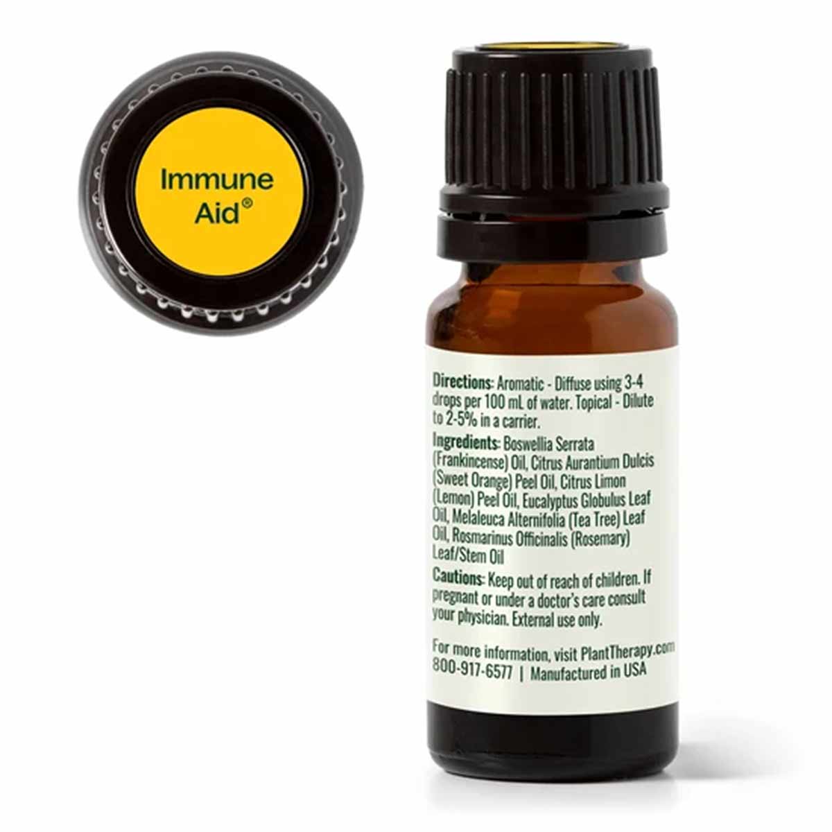 An amber glass dropper bottle with a black cap and a back label listing directions, ingredients, and cautions, beside a yellow "Immune Aid" cap top.