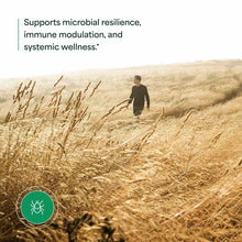 NutraMedix Japanese Knotweed supplement package with person walking through dry grass field and green circular logo with tick