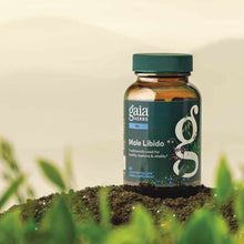 Gaia Herbs Male Libido supplement bottle with green cap and dark label, containing 60 liquid phyto-caps, positioned on soil w