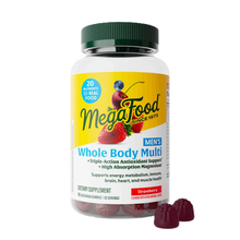 MegaFood Men's Whole Body Multi supplement bottle with green cap containing strawberry-flavored gummies and two gummies displ