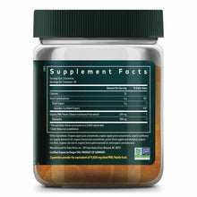 Bottle of Gaia Herbs milk thistle gummies with green cap, displaying supplement facts label and orange-colored gummies inside