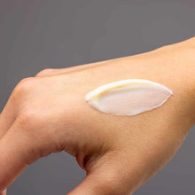 White body cream swatch applied to skin demonstrating texture and consistency.